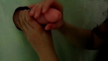 Swallowing cum from gloryhole in a swinging session