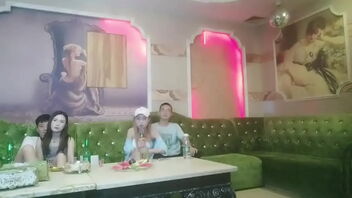 Kinky gang sex in a Chinese KTV bar with a sitting woman and four men