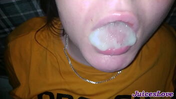 Close up of a slut drinking a mouthful of cum in this amateur video.