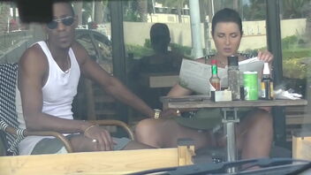 A cheating wifey caught on camera while flirting with a ebony man in a cafe.