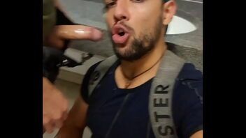 Gay public hookup in the subway bathroom with a blow job